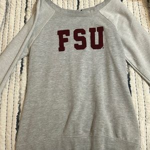 This medium, grey sweater is made by creative apparel concepts